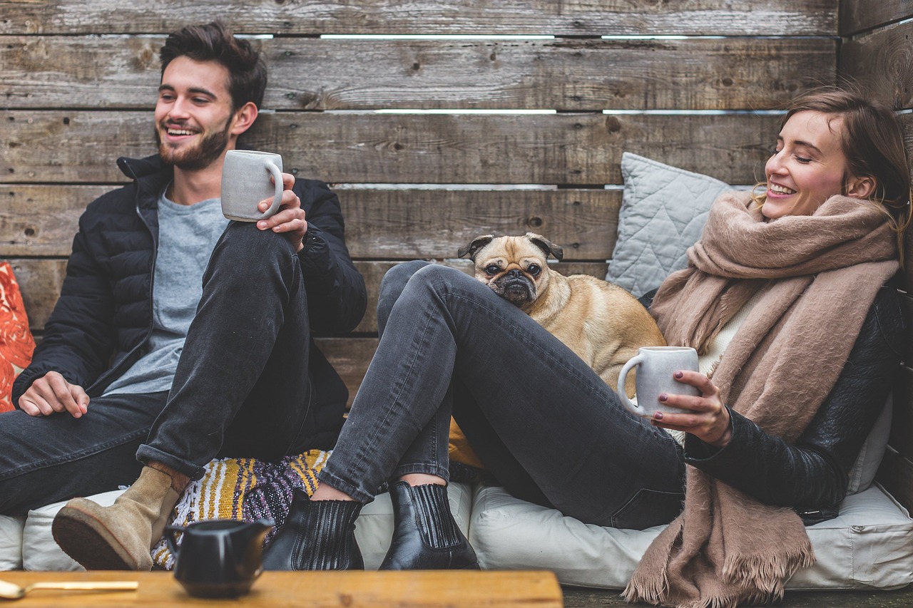 Two people and a dog symbolizing the cast of a novel by a self-publishing author